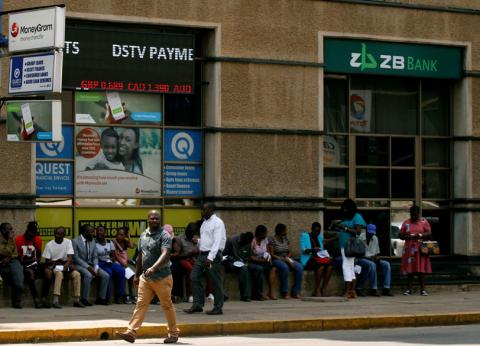 Zimbabweans queue outside a bank in Harare, Zimbabwe, February 25, 2019. PHOTO BY REUTERS/Philimon Bulawayo