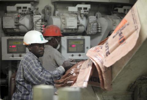 Labourers work at the Dangote Cement factory in Obajana village in Nigeria's central state of Kogi. PHOTO BY REUTERS/Akintunde Akinleye
