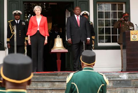Britain's Prime Minister Theresa May and South African President Cyril Ramaphosa take part in the ceremony to hand over the bell of the SS Mendi in Cape Town, South Africa, August 28, 2018. PHOTO BY REUTERS/Mike Hutchin