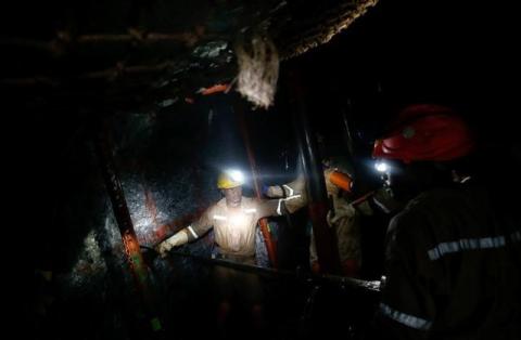 Mine workers employed at Sibanye Gold's Masimthembe shaft operate a drill in Westonaria, South Africa, April 3, 2017. PHOTO BY REUTERS/Mike Hutchings