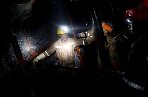 Miners work deep underground at Sibanye Gold's Masimthembe shaft in Westonaria, South Africa, April 3, 2017. PHOTO BY REUTERS/Mike Hutchings