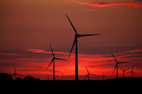Power-generating windmill turbines are pictured at sunset at a wind park in Cagnicourt near Cambrai, France, May 22, 2019. PHOTO BY REUTERS/Pascal Rossignol