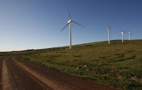 Giant wind turbines dot the landscape at the Darling Wind Power national demonstration project near Cape Town in a file photo. PHOTO BY REUTERS/Mike Hutchings