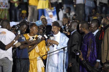 Senegal's former President Abdoulaye Wade speaks to a crowd upon his arrival in Dakar, April 26, 2014. PHOTO BY REUTERS/Mamadou Gomis