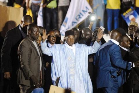 Senegal's former President Abdoulaye Wade greets a crowd upon his arrival in Dakar, April 26, 2014. PHOTO BY REUTERS/Mamadou Gomis