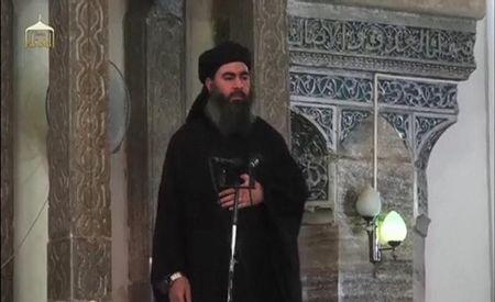 Abu Bakr al-Baghdadi at a mosque in the centre of Iraq's second city, Mosul, according to a video recording posted on the Internet on July 5, 2014, in this still image taken from video. PHOTO BY REUTERS/Social Media Website via Reuters TV