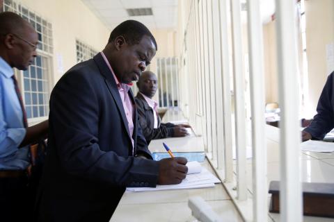 Kenyan activist Okiya Omtatah files a lawsuit seeking the arrest of two Kenyan ministers and a senior official for contempt of court after the government ignored a court order to reopen three television channels shut down over their political coverage, at the Milimani Court in Nairobi, Kenya, February 5, 2018. PHOTO BY REUTERS/Baz Ratner
