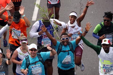 Activist and treegrower Siyabulela Sokomani celebrates as he approaches the final stretch of the Cape Town marathon, in South Africa, September 15, 2019. PHOTO BY REUTERS/Mike Hutchings