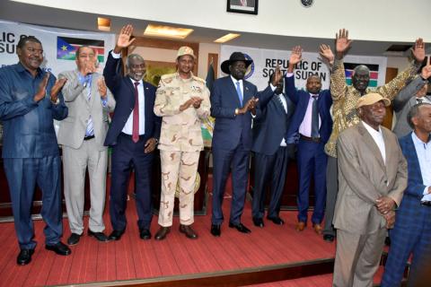 Sudanese officials, rebels and diplomats react after signing the initial agreement on a roadmap for peace talks in Juba, South Sudan, September 11, 2019. PHOTO BY REUTERS/Jok Solomun