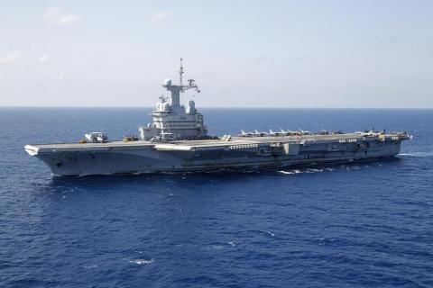 France's flagship Charles de Gaulle aircraft carrier makes it way through the Mediterranean Sea while on mission, March 26, 2011. PHOTO BY REUTERS/Benoit Tessier