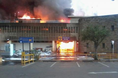 The arrival lounge of Jomo Kenyatta International Airport is seen in flames, in Kenya's capital Nairobi