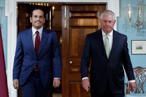 U.S. Secretary of State Rex Tillerson (R) walks with Qatari Foreign Minister Sheikh Mohammed bin Abdulrahman Al Thani before their meeting at the State Department in Washington, U.S., June 27, 2017. PHOTO BY REUTERS/Yuri Gripas