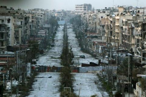 A general view shows a damaged street with sandbags used as barriers in Aleppo's Saif al-Dawla district, Syria, March 6, 2015. PHOTO BY REUTERS/Hosam Katan