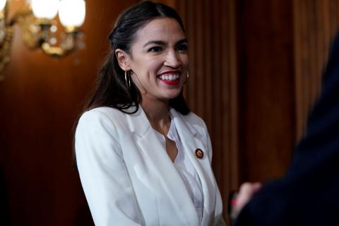 Rep. Alexandria Ocasio-Cortez (D-NY) waits for a ceremonial swearing-in picture on Capitol Hill in Washington, U.S., January 3, 2019. PHOTO BY REUTERS/Joshua Roberts
