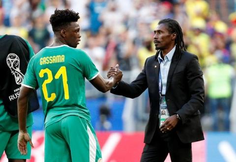 Senegal coach Aliou Cisse and Lamine Gassama react afer the match. PHOTO BY REUTERS/Max Rossi