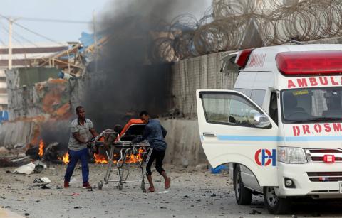 Somali rescue workers carry an unidentified man injured from the scene of an explosion in Mogadishu, Somalia, November 9, 2018. PHOTO BY REUTERS/Feisal Omar