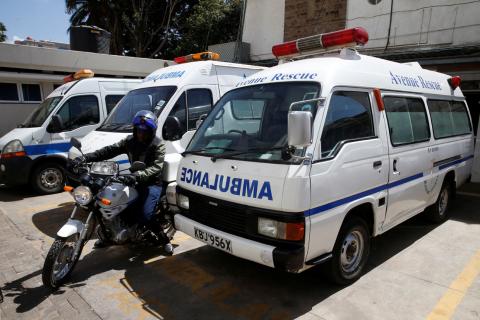 A motorcycle-riding paramedic manoeuvers between parked ambulances at the Avenue hospital in Nairobi, Kenya, February 1, 2019. PHOTO BY REUTERS/Baz Ratner