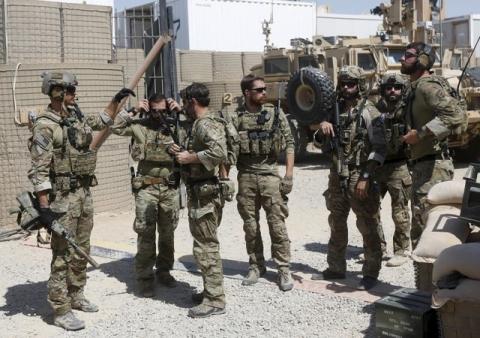 U.S. special forces soldiers talk to each other before they leave their base in Helmand, Afghanistan, September 28, 2015. PHOTO BY REUTERS/Omar Sobhani