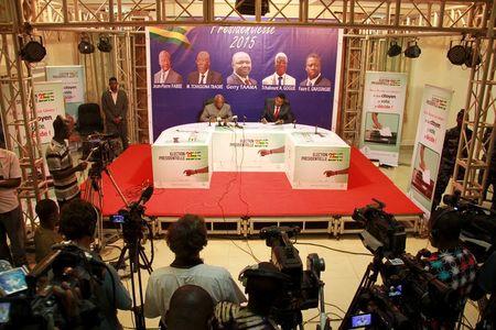 Issoufou Taffa Tabiouon (centre L), chairman of the Independent National Electoral Commission in Togo, announces the results of Saturday's presidential election, in Lome April 28, 2015. PHOTO BY REUTERS/Noel Koukou Tadegnon