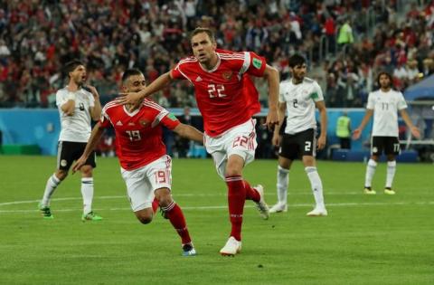 Russia's Artem Dzyuba celebrates scoring their third goal with Aleksandr Samedov. PHOTO BY REUTERS/Pilar Olivares