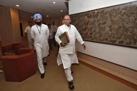 Finance and Defence Minister Arun Jaitley (C) arrives to attend a meeting with the finance ministers of states on the Goods and Services Tax (GST) issues in New Delhi, July 3, 2014. PHOTO BYREUTERS/Adnan Abidi