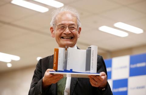 Asahi Kasei honorary fellow Akira Yoshino, 2019 Nobel Prize in Chemistry winner, holds a mock of lithium-ion battery during a news conference in Tokyo, Japan, October 9, 2019. PHOTO BY REUTERS/Issei Kato