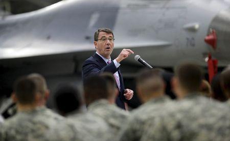 U.S. Defense Secretary Ash Carter addresses U.S. military personnel during a meeting near an F-16 fighter jet at Osan U.S. Air Base in Pyeongtaek, south of Seoul, South Korea Thursday, April 9, 2015. PHOTO BY REUTERS/Lee Jin-man