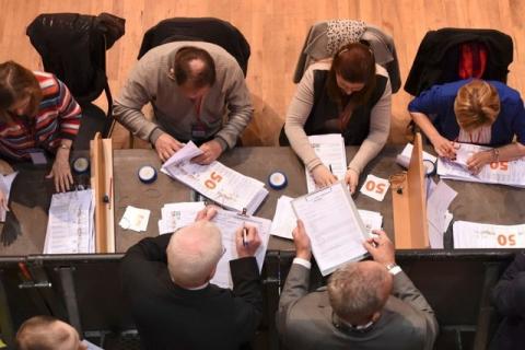 Officials sort through ballot papers during a general election count at the Count centre in Castlebar, Ireland, February 27, 2016. PHOTO BY REUTERS/Clodagh Kilcoyne