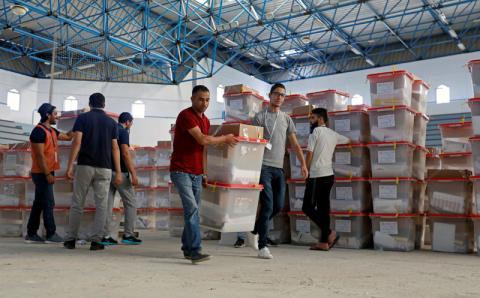 Polling agents carry ballot boxes and election materials to be distributed to voting stations, ahead of the Sunday's parliamentary elections, in Tunis, Tunisia, October 5, 2019. PHOTO BY REUTERS/Zoubeir Souissi