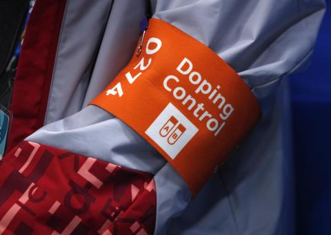 A doping control official attends a game at Pyeongchang 2018 Winter Olympics. PHOTO BY REUTERS/Brian Snyder