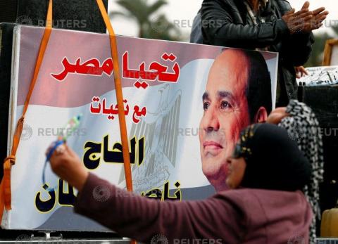 Supporters of Egyptian President Abdel Fattah al-Sisi dance on the seventh anniversary of the uprising that ended the 30-year reign of Hosni Mubarak in Tahrir square in Cairo, Egypt, January 25, 2018. PHOTO BY REUTERS/Mohamed Abd El
