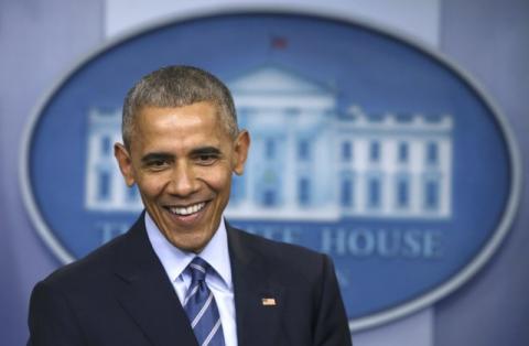 U.S. President Barack Obama smiles as he speaks to journalists during his last news conference of the year at the White House in Washington, U.S., December 16, 2016. PHOTO BY REUTERS/Carlos BarriaBy Roberta Rampton and Jeff Mason