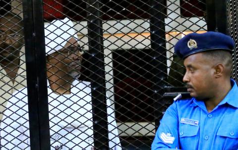 Sudan's former president Omar Hassan al-Bashir sits inside a cage during the hearing of the verdict that convicted him of corruption charges in a court in Khartoum, Sudan, December 14, 2019. PHOTO BY REUTERS/Mohamed Nureldin Abdallah