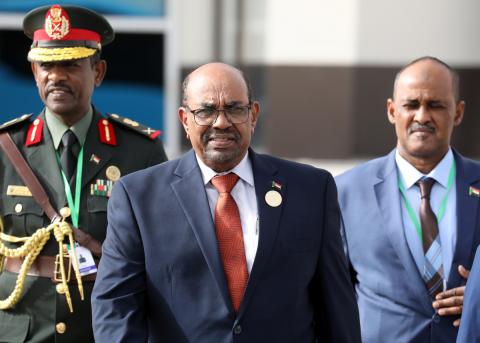 Sudan's President Omar al-Bashir walks with officials as he leaves the African Union (AU) summit in Nouakchott, Mauritania, July 2, 2018. PHOTO BY REUTERS/Ludovic Marin