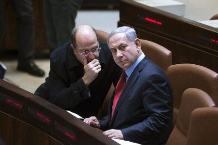 Israel's Defence Minister Moshe Yaalon (L) speaks with Prime Minister Benjamin Netanyahu during a session of the Knesset, the Israeli parliament, in Jerusalem, December 1, 2014. PHOTO BY REUTERS/Ronen Zvulun