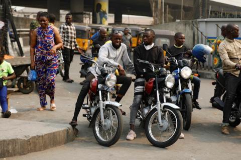 Motorcycle taxi drivers sit on their bikes, popularly called "Okada", in Obalende, Lagos Island, Nigeria, on January 27, 2020. PHOTO BY REUTERS/Temillade Adelaja
