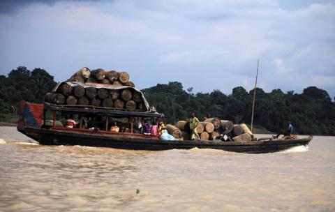 People travel on a locally built passenger boat loaded with oil containers through a creek on the River Nun in Nigeria's oil state of Bayelsa, December 6, 2012. PHOTO BY REUTERS/Akintunde Akinleye