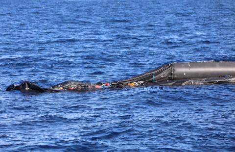 A boat that was carrying immigrants is seen in the Mediterranean Sea off the coast of Libya, March 30, 2018. PHOTO BY REUTERS/Hani Amara