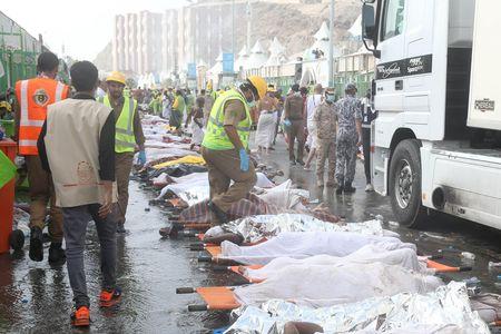 The bodies of Muslim pilgrims are laid on stretchers after a stampede at Mina, outside the holy Muslim city of Mecca, September 24, 2015. PHOTO BY REUTERS/Stringer