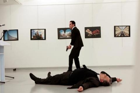 Russian Ambassador to Turkey Andrei Karlov lies on the ground after he was shot by Mevlut Mert Altintas at an art gallery in Ankara, Turkey, December 19, 2016. PHOTO BY REUTERS/Hasim Kilic