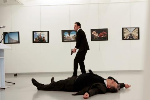 Russian Ambassador to Turkey Andrei Karlov lies on the ground after he was shot by Mevlut Mert Altintas at an art gallery in Ankara, Turkey, December 19, 2016. PHOTO BY REUTERS/Hasim Kilic