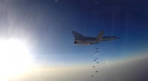 A still image, taken from video footage and released by Russia's Defence Ministry on August 16, 2016, shows a Russian Tupolev Tu-22M3 long-range bomber based in Iran dropping off bombs at an unknown location in Syria. PHOTO BY REUTERS/Ministry of Defence of the Russian Federation