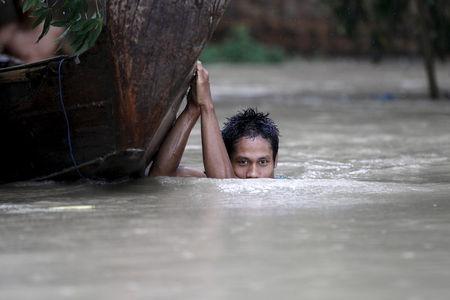NYAUNGDON, Myanmar (Thomson Reuters Foundation) - Authorities are racing to clean contaminated water sources in flood-hit parts of Myanmar, while distributing bottled water, chlorine powder and purification tablets as they struggle with diarrhea outbreaks.  Torrential rains since late June triggered floods and landslides across central and western Myanmar, killing more than 100 people and affecting 1.3 million, according to the U.N. Office for the Coordination of Humanitarian Affairs.  In four hard-hit stat