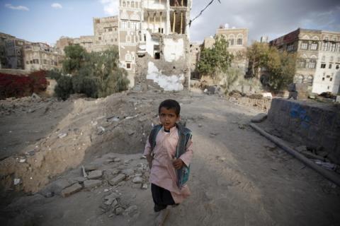 A boy walks past houses damaged in the current conflict in the old quarter of Yemen's capital Sanaa, November 27, 2015. PHOTO BY REUTERS/Khaled Abdullah