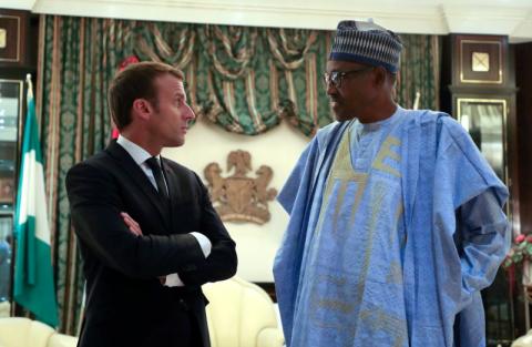 French President Emmanuel Macron speaks with Nigeria's President Muhammadu Buhari at the Presidential State House in Abuja, Nigeria, July 3, 2018. PHOTO BY REUTERSLudovic Marin/Pool