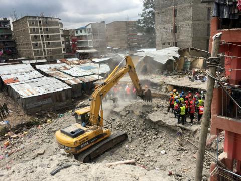Rescue workers use a bulldozer as they continue to search for survivors in Huruma neighbourhood in the rubble of a six-storey building that collapsed in Nairobi, Kenya, May 5, 2016. PHOTO BY REUTERS/Thomas Mukoya