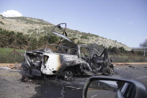 A burnt vehicle is seen near the village of Ghajar on Israel's border with Lebanon, January 28, 2015. PHOTO BY REUTERS/Maruf Khatib