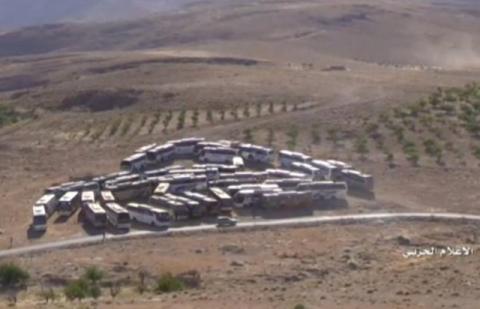 A still image taken from Hezbollah Military handout on July 31, 2017 shows buses that will transfer Nusra Front militants at an unidentified location at the Lebanese-Syrian border. PHOTO BY REUTERS/Hezbollah Military