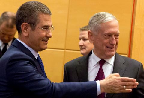 U.S. Secretary of Defence Jim Mattis poses with Turkish Defence Minister Nurettin Canikli during a NATO defence ministers meeting at the Alliance headquarters in Brussels, Belgium, February 14, 2018. PHOTO BY REUTERS/Virginia Mayo