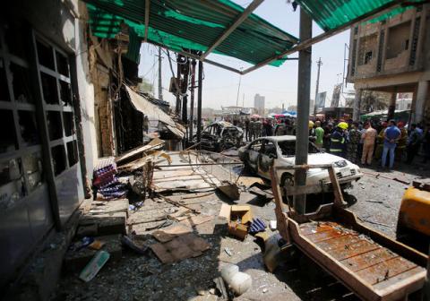 Damaged shops are seen at the site of car bomb attack near a government office in Karkh district in Baghdad, Iraq, May 30, 2017. PHOTO BY REUTERS/Khalid al-Mousily